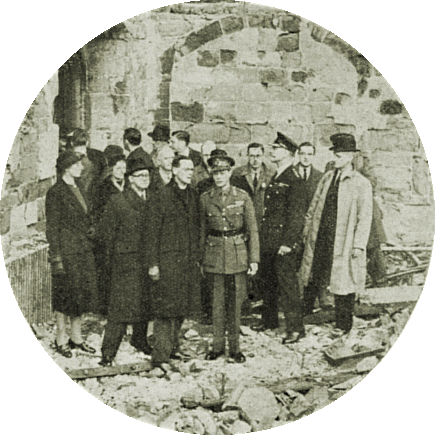 Official group photograph of King George VI in the ruins of Coventry Cathedral on Saturday 16th November 1940.