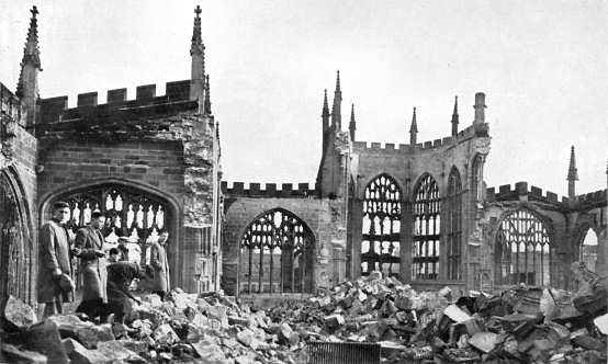 Youngsters searching amongst the rubble in the remains of the cathedral.